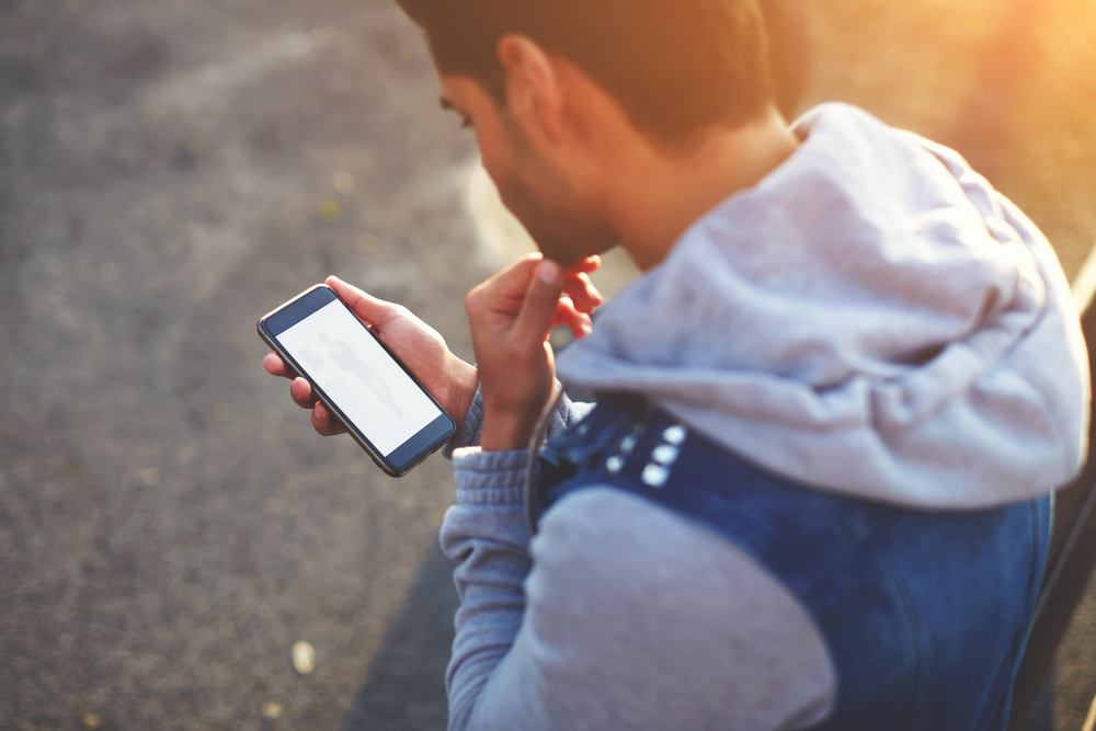 Young man using the iCloud activation lock removal service from Mobile Unlocked.