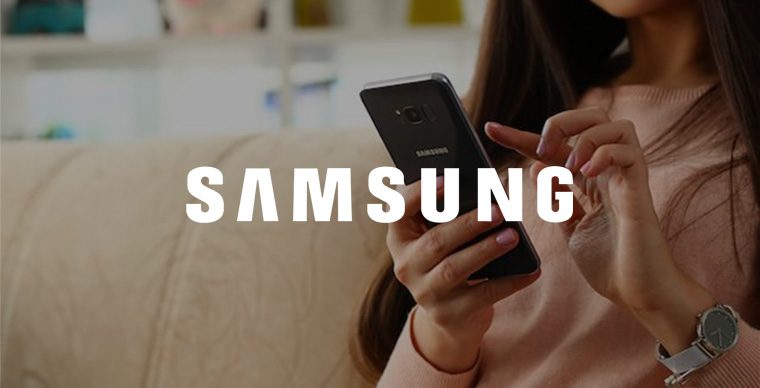 Young brunette unlocking her Samsung phone online.