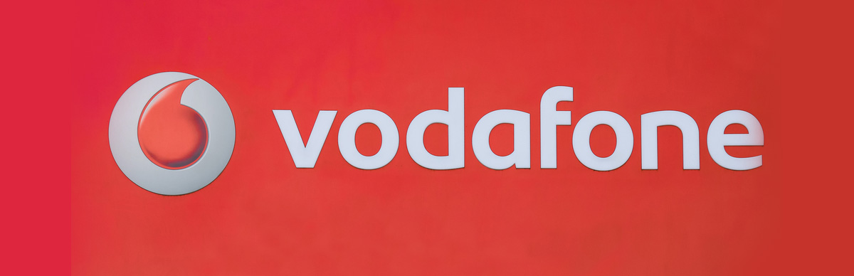 Vodafone phone unlock logo in red.