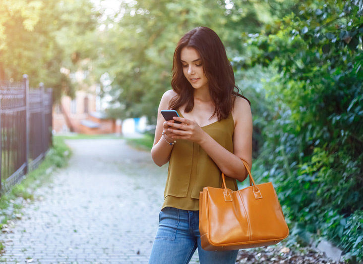 Brunette woman with a new unlock Cellcom device.